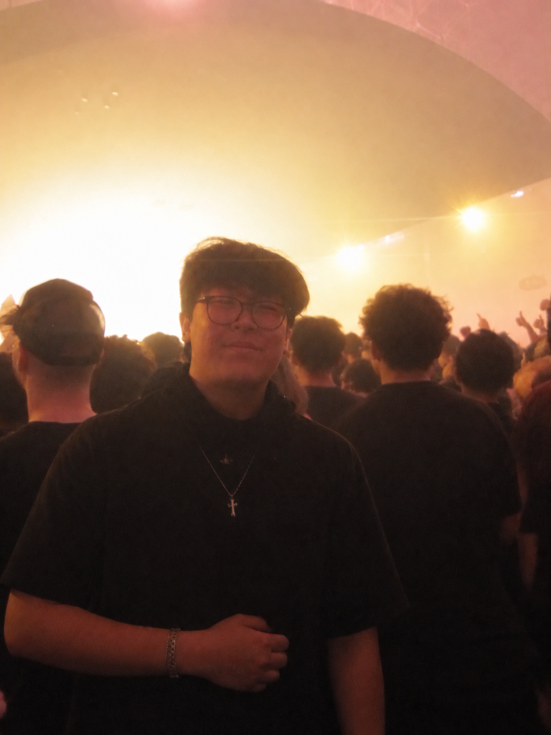 Ethan at a concert in warm stage lighting